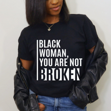 Load image into Gallery viewer, Black woman in black t-shirt with white text